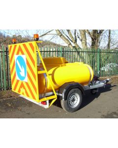 Yellow Water Bowser with additional Chevron Add-On Product pictured in situation by roadside.